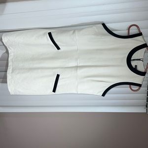 White dress midi with leather black accents around arms neck & pockets